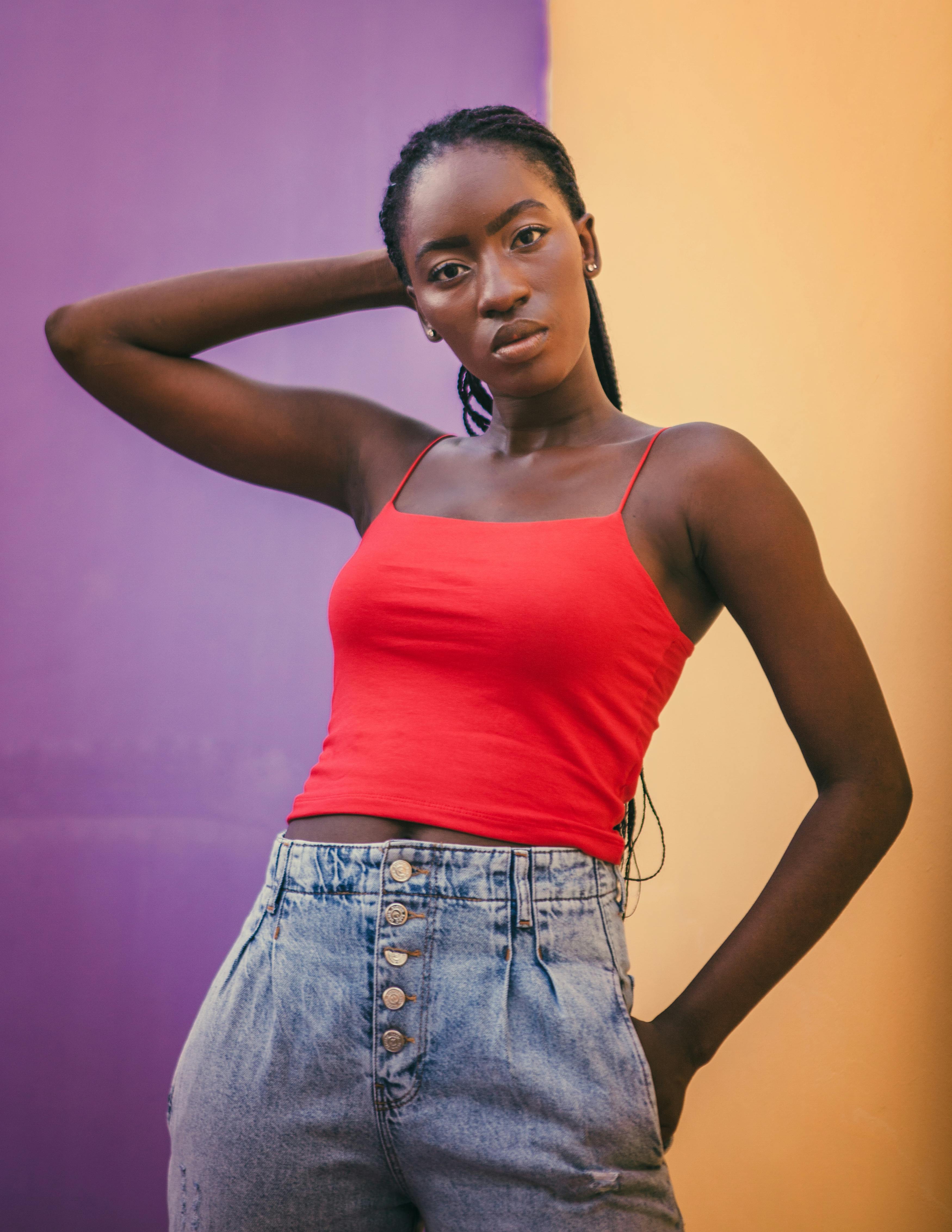 Woman in Red Spaghetti Strap Top and Denim Jeans · Free Stock Photo