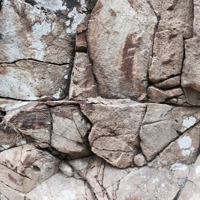 Cracked stone wall surface — photo by Joao Delicado on Pexels