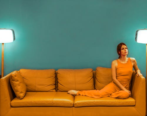 Calm woman sitting on couch