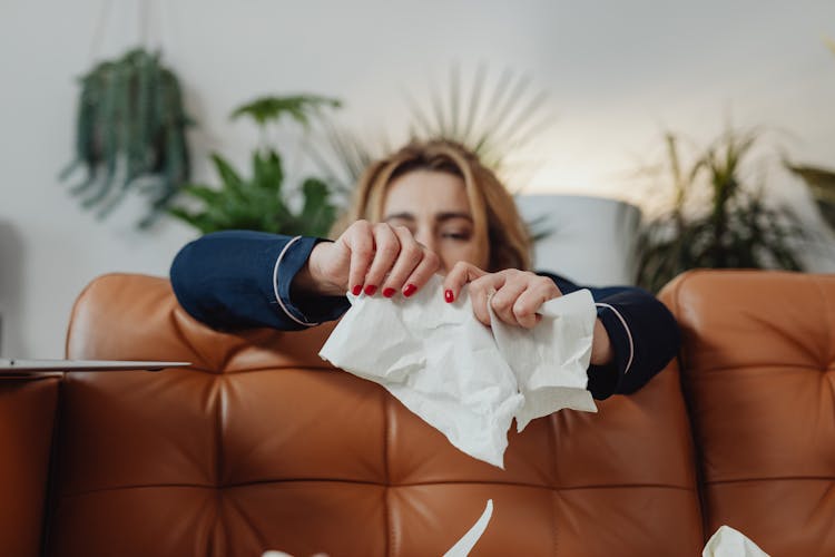 Woman Tearing A Paper