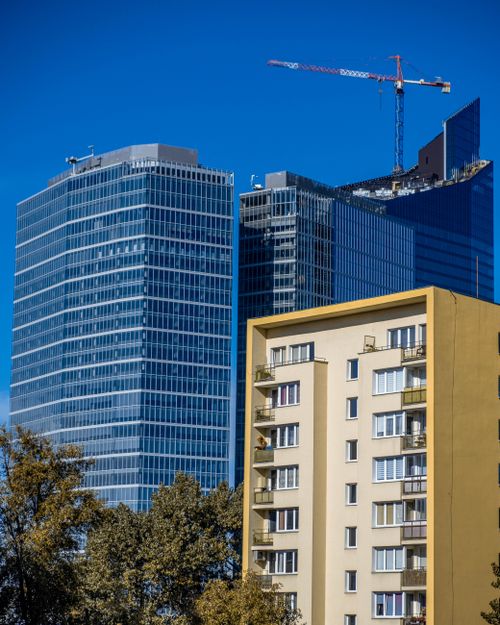 Free View of modern skyscrapers contrasting with older buildings in Warsaw, Poland. Stock Photo