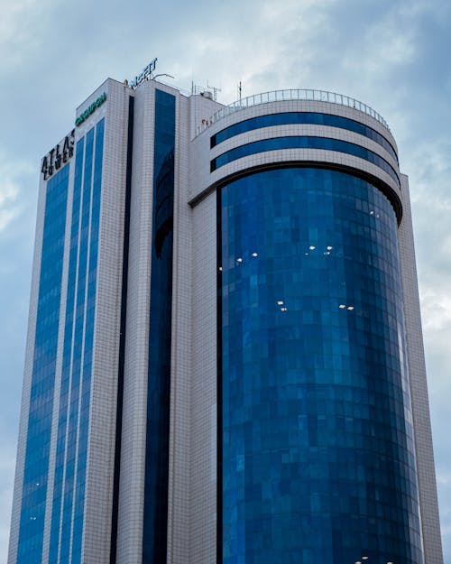 High Rise Building Under a Cloudy Sky