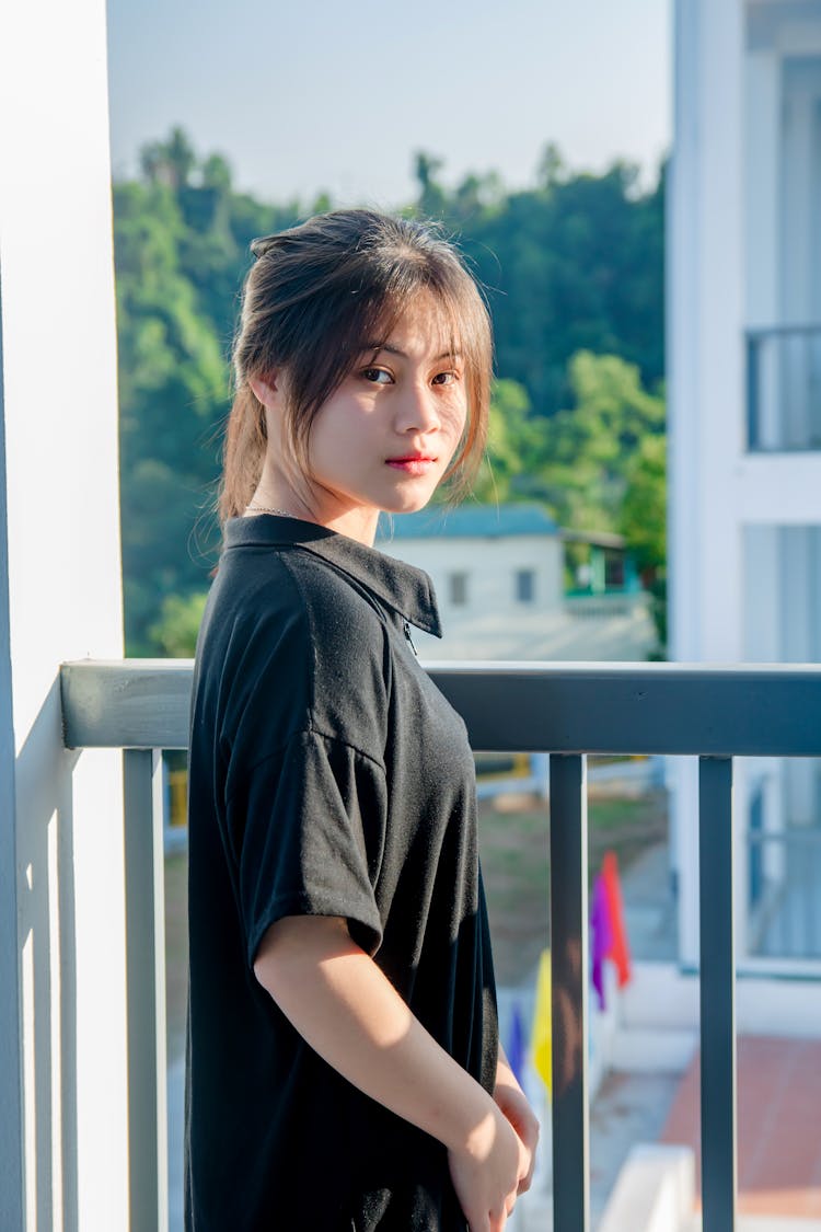 Photo Of A Woman Wearing Black Polo Shirt