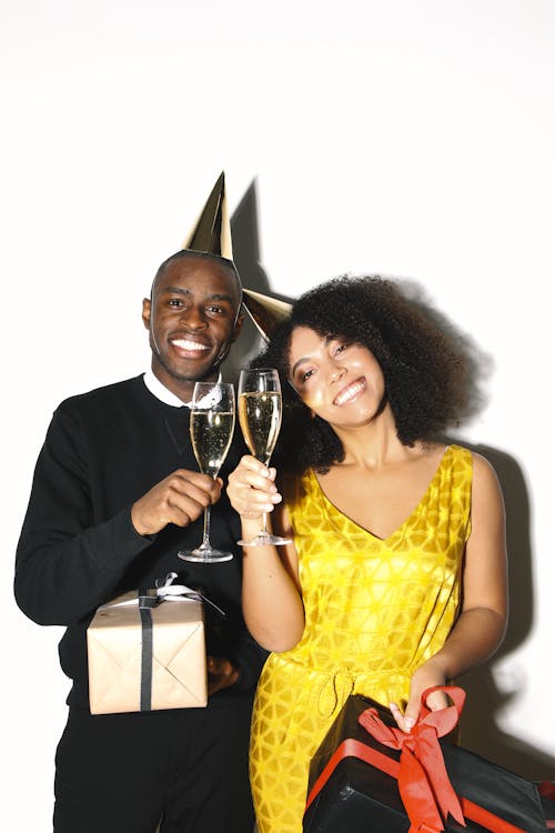 A Man and Woman Holding Glasses of Wine