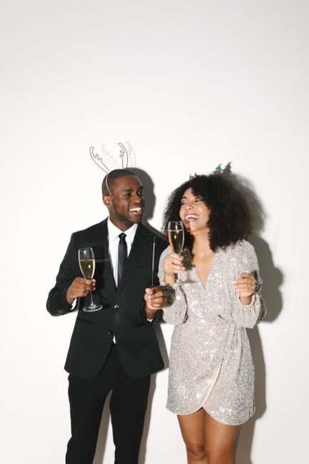 A festive moment of friends celebrating with champagne and laughter.