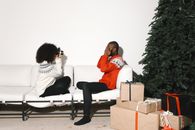 2 Women Sitting on White Couch
