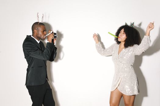 Man in Black Suit Jacket and Woman in White Lace Dress Shirt