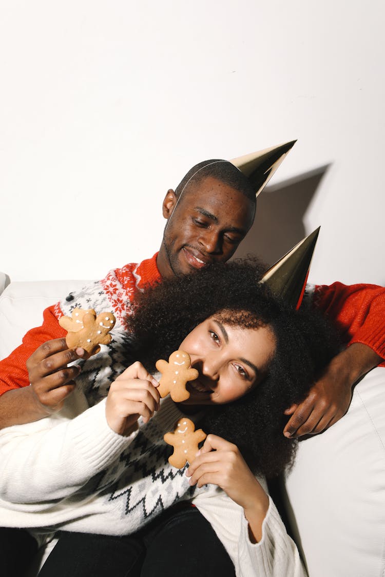 A Man And Woman Eating Cake