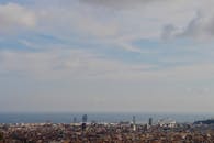 An Aerial View of Congested City Buildings Near the Sea