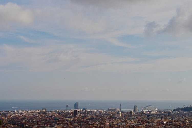 An Aerial View Of Congested City Buildings Near The Sea