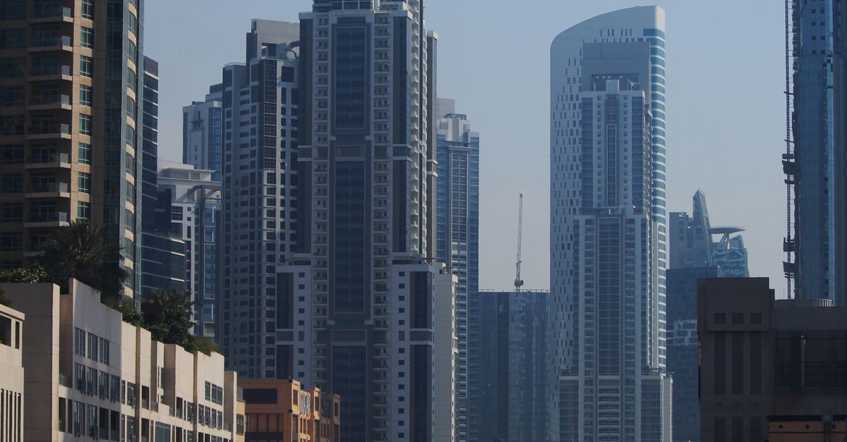 Cars on Road Near High Rise Buildings · Free Stock Photo