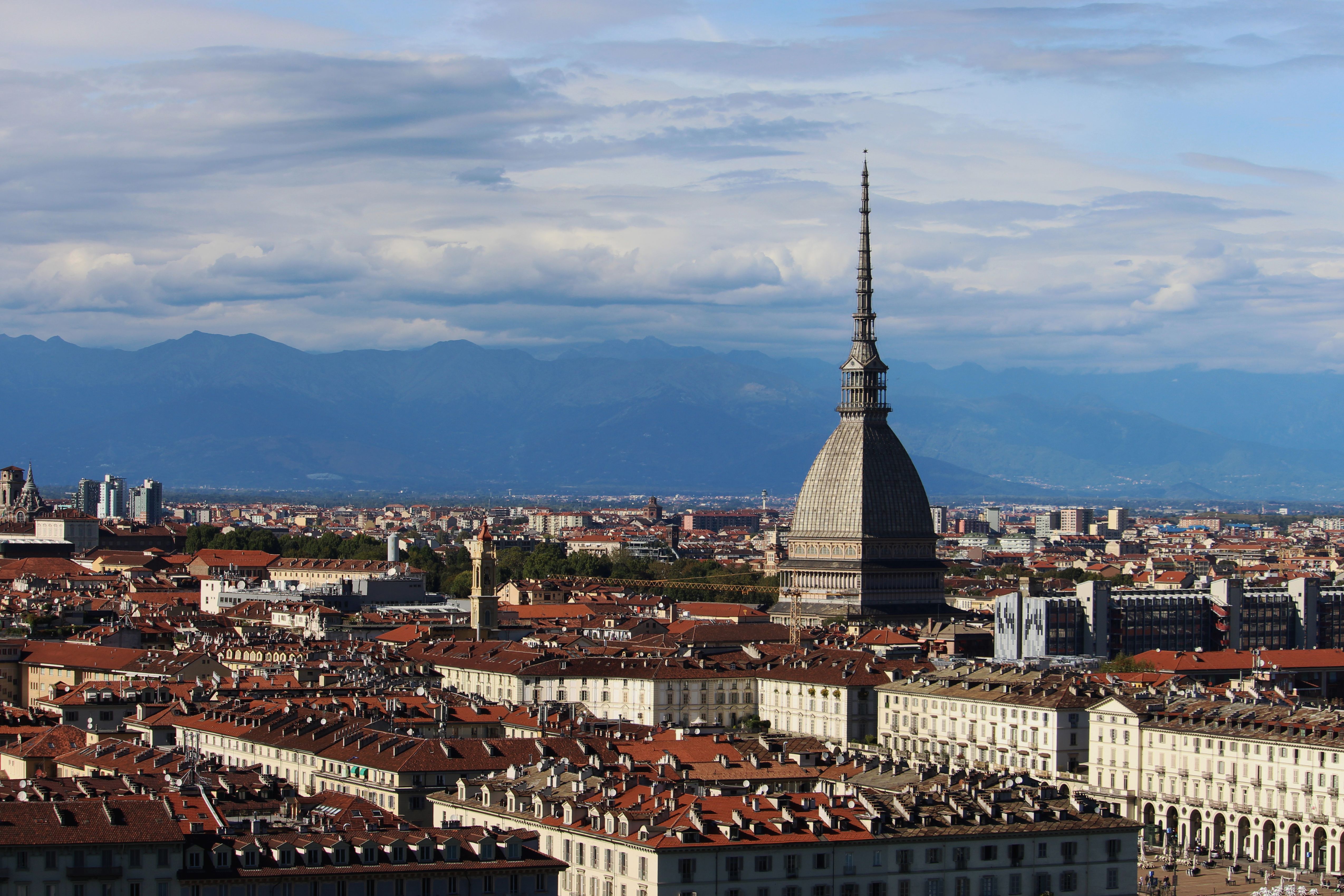 Aerial view of Turin and the Mole Antonelliana with the Alps beyond