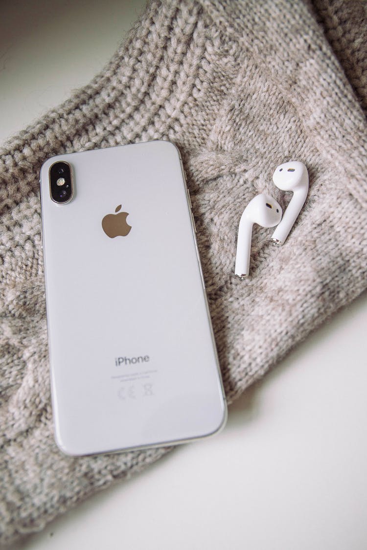 White Apple Products On Gray Textile