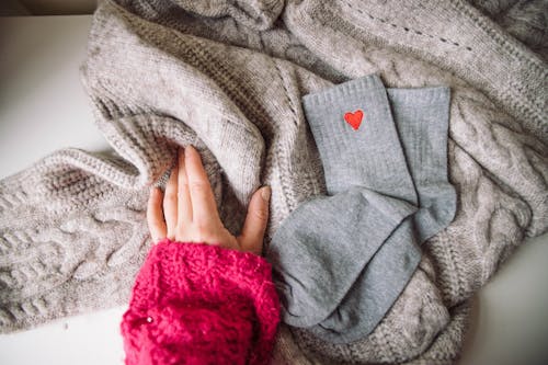 Free Person Touching a Knitted Sweater Stock Photo