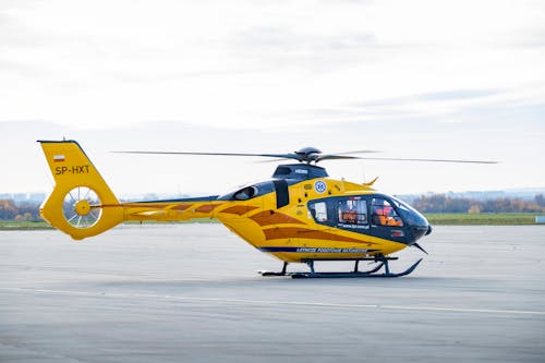 Free Yellow and Black Helicopter on Concrete Pavement Stock Photo