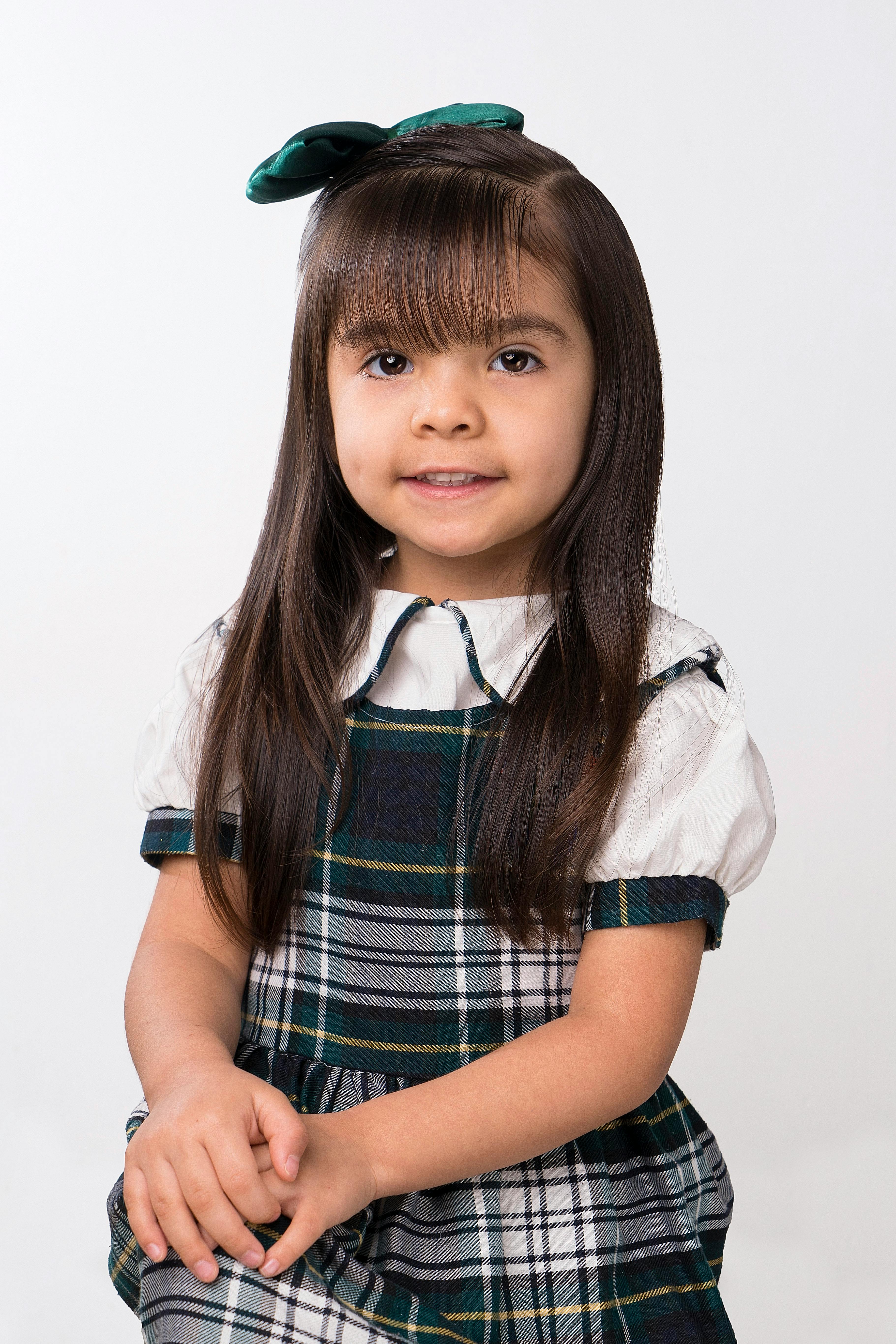 Free Girl in White and Green DressSmiling Stock Photo