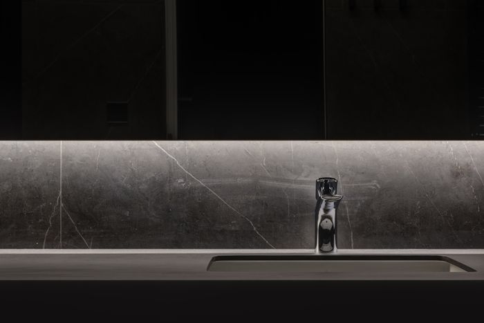 Modern illuminated faucet and washbasin installed