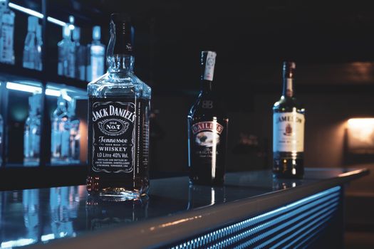 Glass Bottles on Brown Counter Top