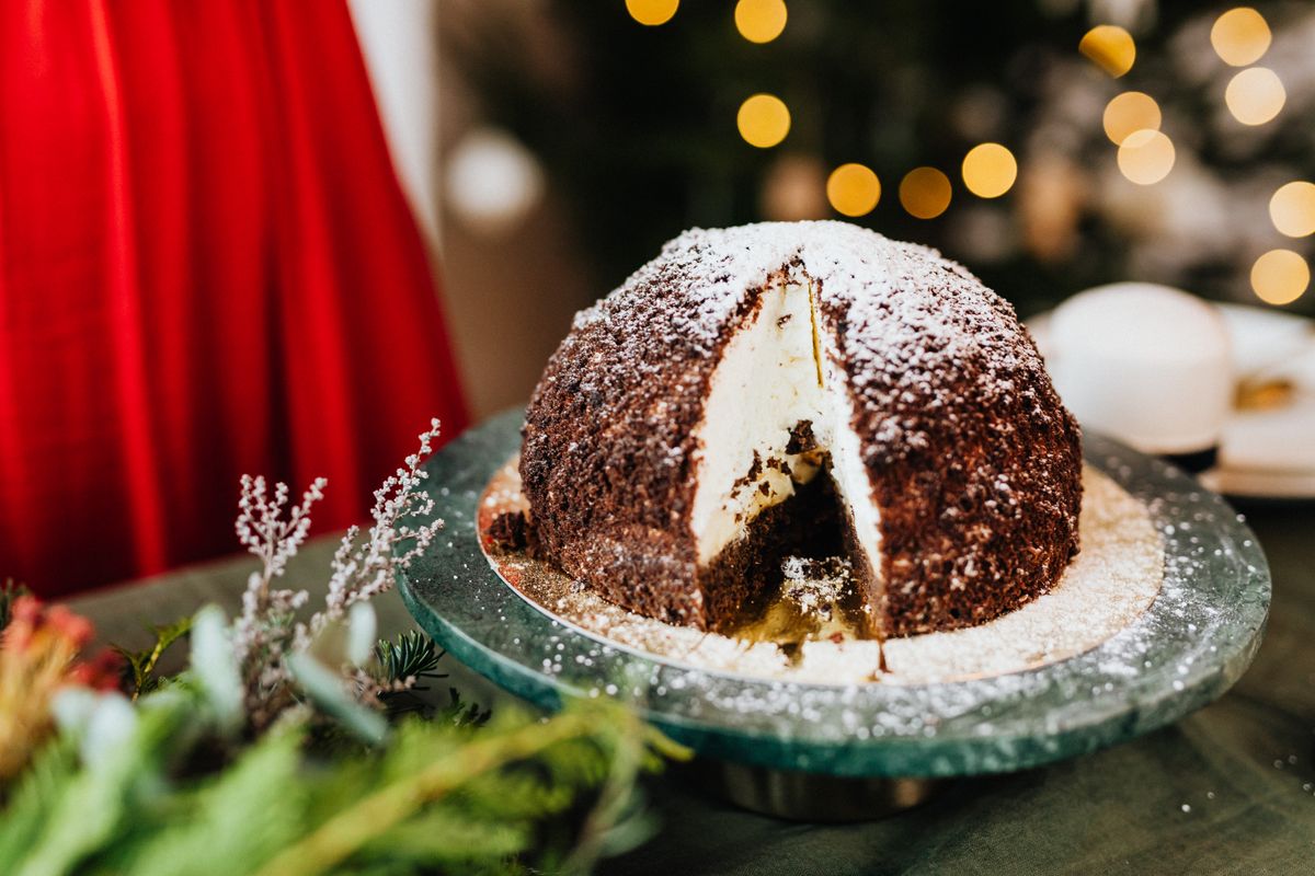 Chocolate Christmas cake with powdered sugar for the dessert table
