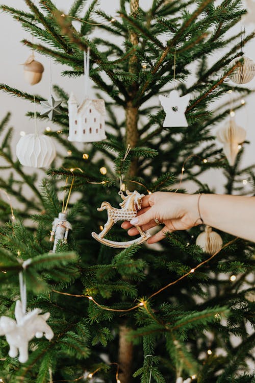 Person Holding Rocking Horse Christmas Tree Ornament