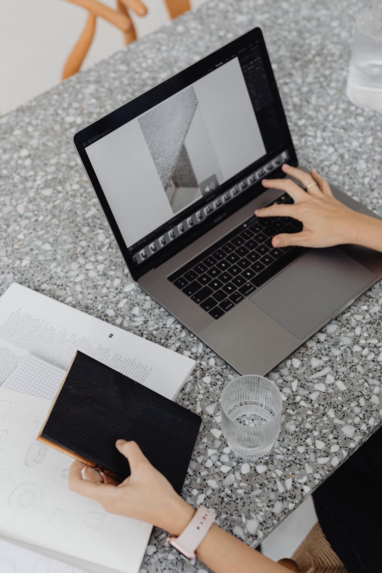 Silver And Black Laptop On Marble Surface