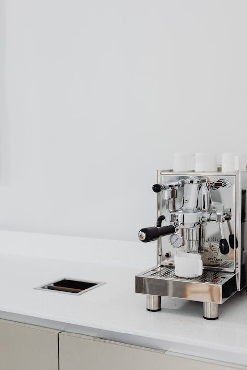 Free A Silver Espresso Machine on a White Counter Stock Photo