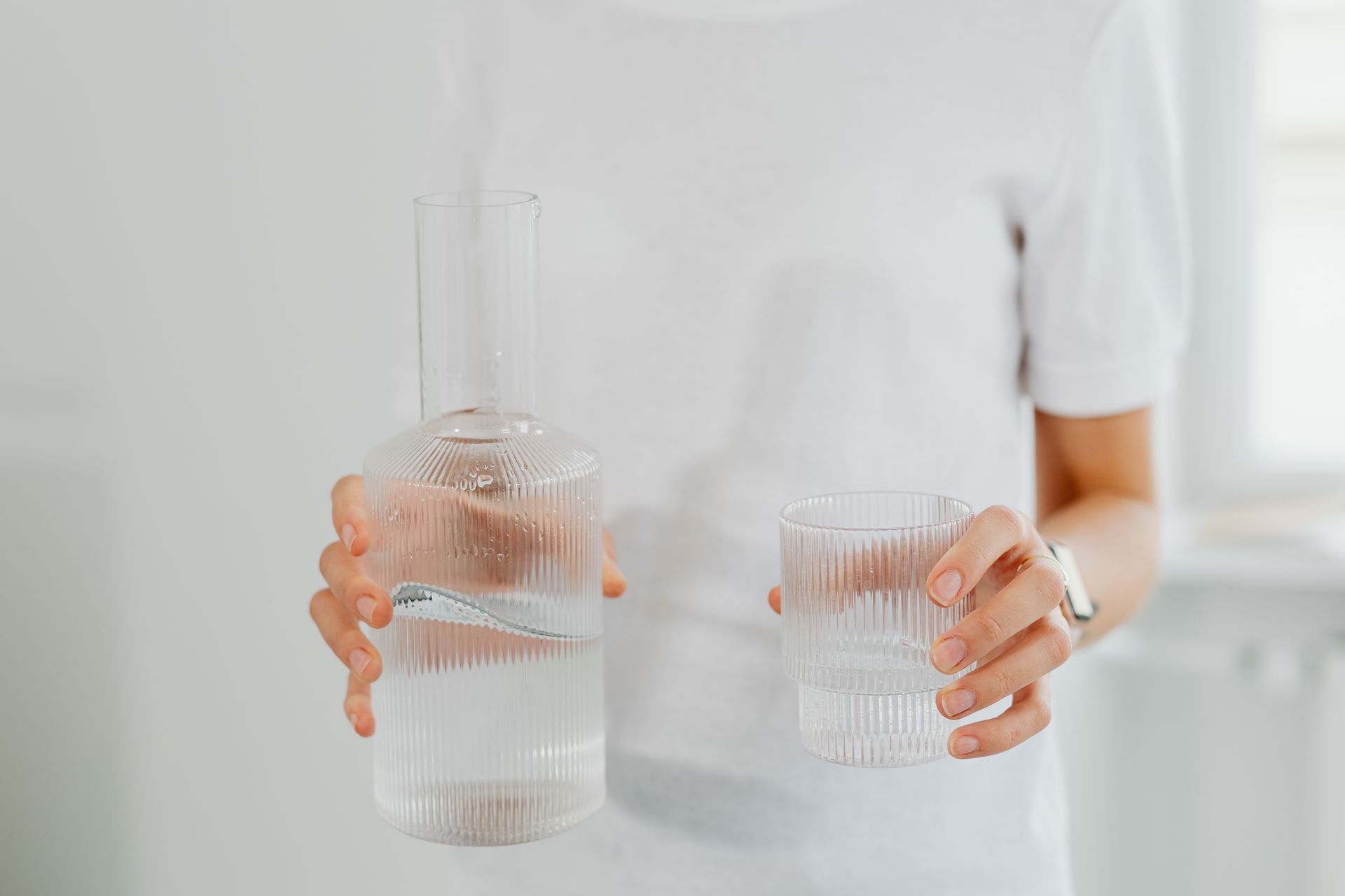 A Person Holding Clear Drinking Glass with Water