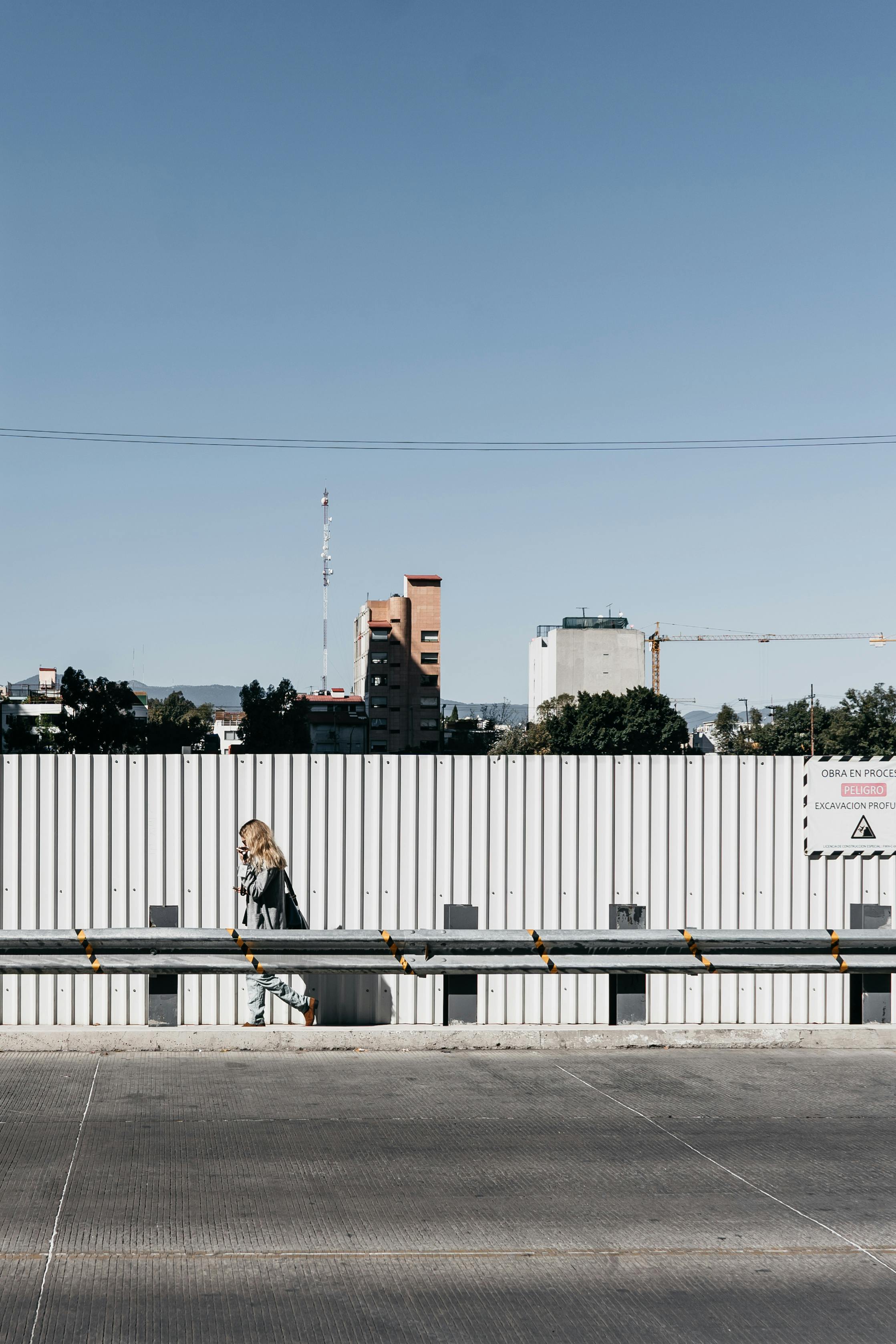 anonymous woman walking near road