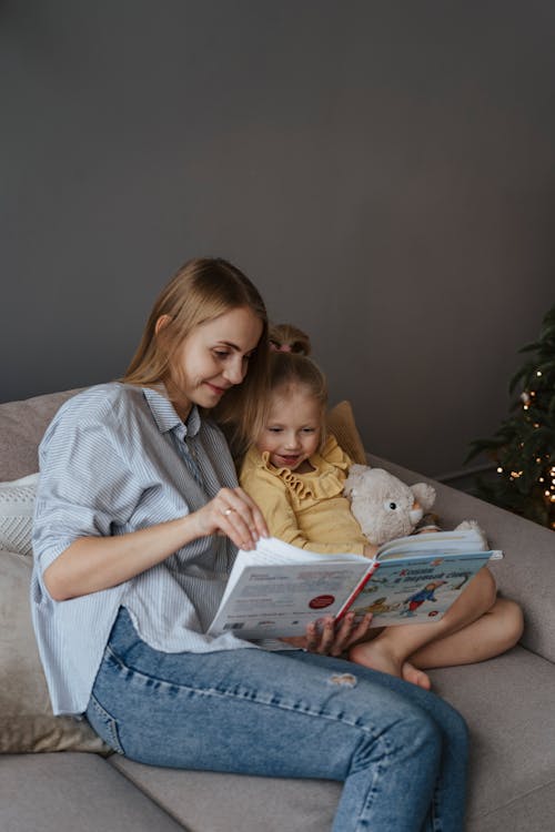 A Mother Reading a Book to Her Daughter 