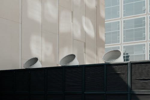 Free Ventilation system on roof of building Stock Photo