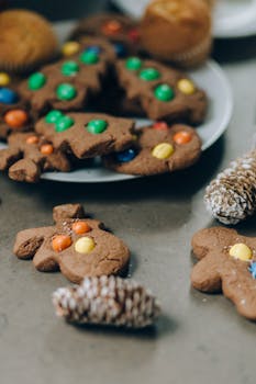 Close-up of homemade gingerbread cookies with colorful candies, perfect for festive occasions.