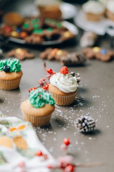 Delicious festive cupcakes with icing and decorations perfect for Christmas celebrations.