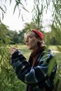 A Man Looking at a Foliage of Green Leaves