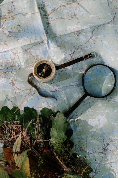 Free Black Magnifying Glass on a Map Stock Photo