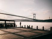Silhouette of a Man Fishing on Dock
