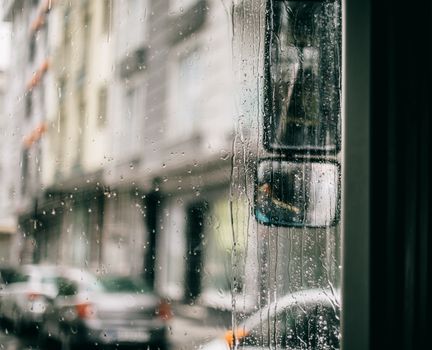 Wet windscreen of bus in rainy day