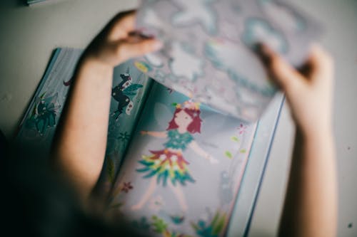 Crop child with opened book