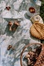 Brown and White Seashell on White and Green Textile