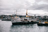 White and Black Ship on Sea Under Gray Sky