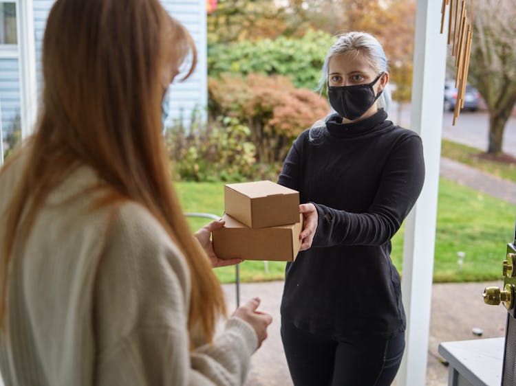 A Woman Receiving A Package