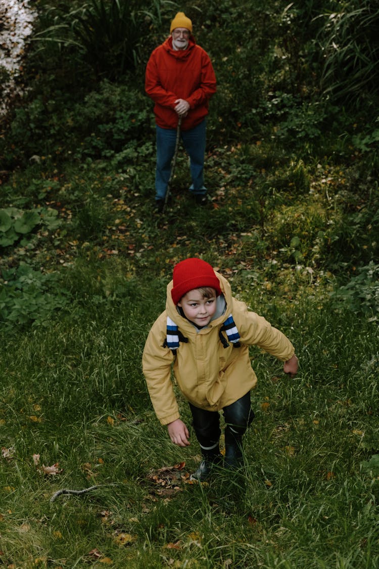 Kid Walking Up A Hill