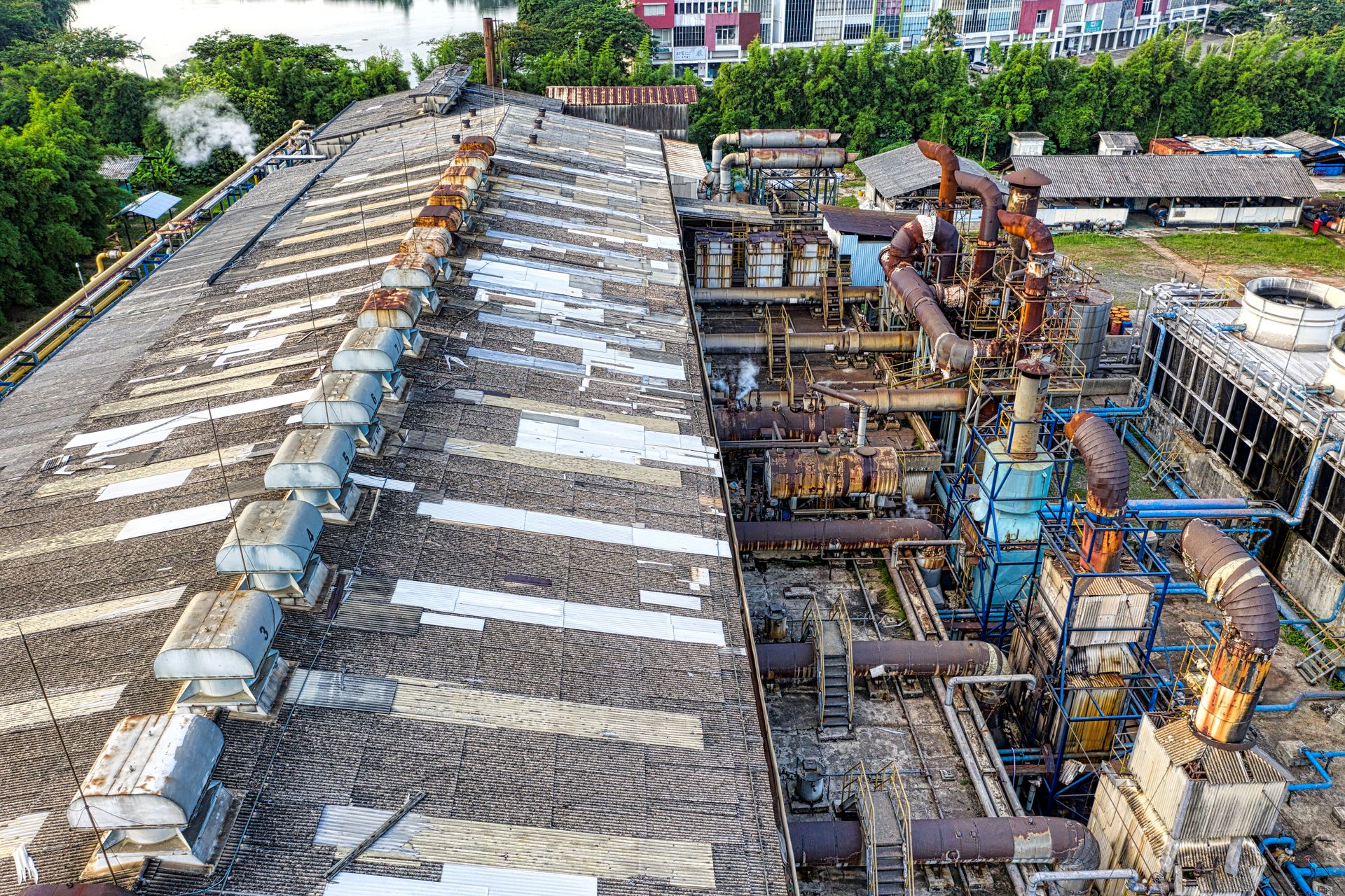 Aerial shot of a large industrial plant with complex piping systems in Banten, Indonesia.
