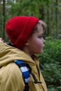 Boy in Red Knit Cap and Brown Jacket