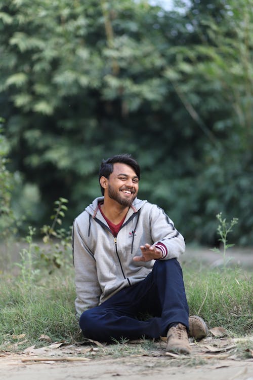 Man Sitting and Smiling