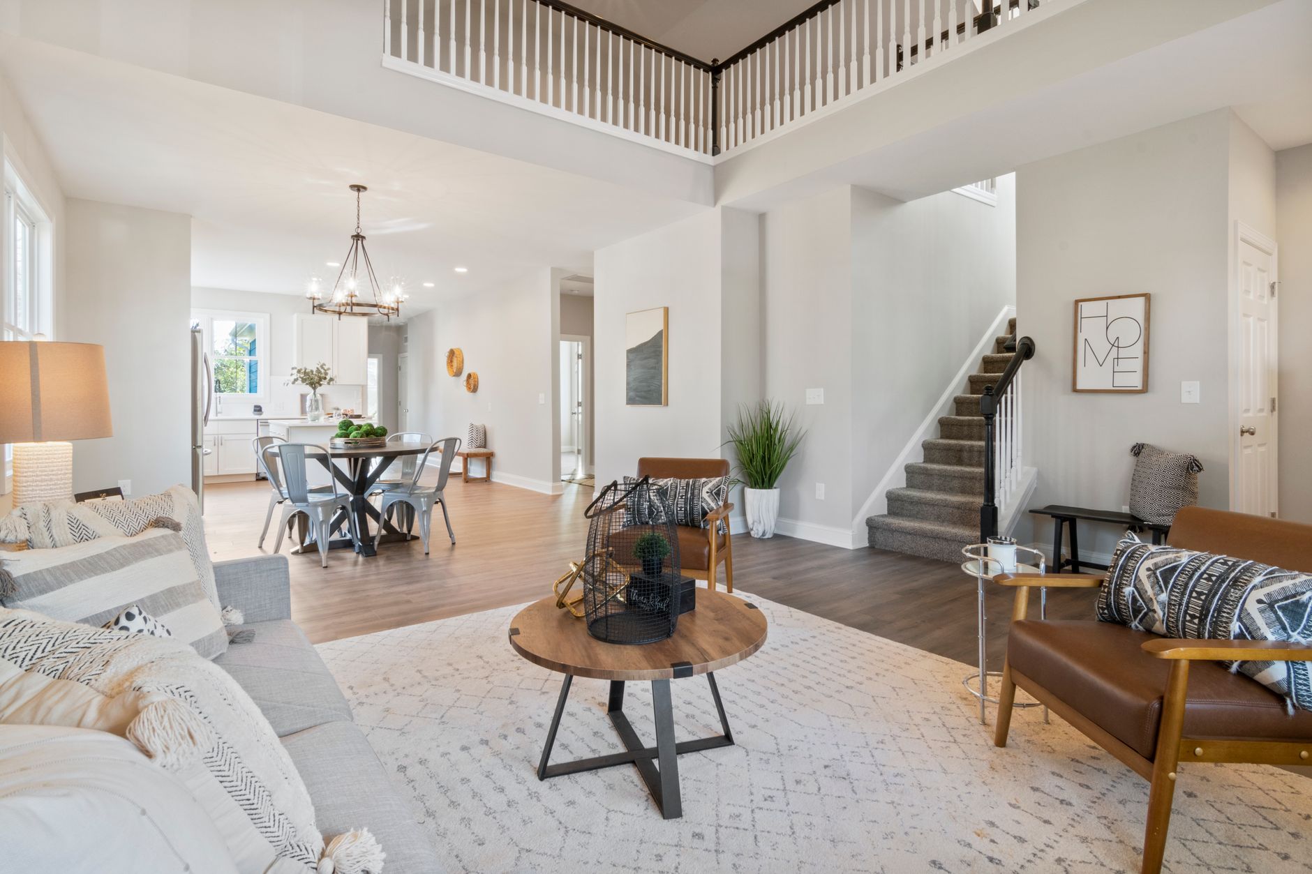 A professionally staged living room in a Venice, Florida home, featuring neutral furnishings and coastal accents designed to appeal to Southwest Florida buyers.