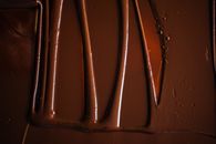Close-up view of smooth, melted chocolate with a luscious, rich texture.