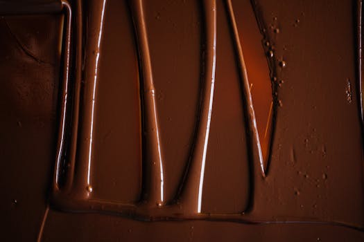 Close-up view of smooth, melted chocolate with a luscious, rich texture.