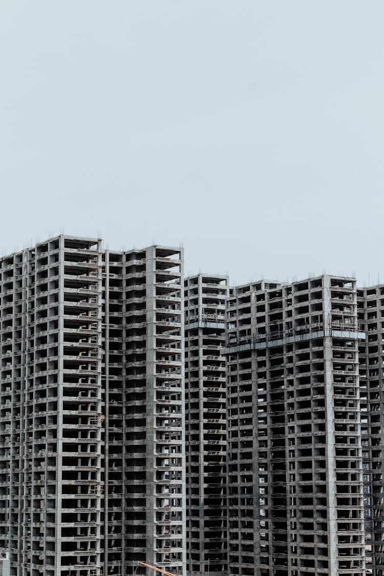 Unfinished Buildings Under Blue Sky