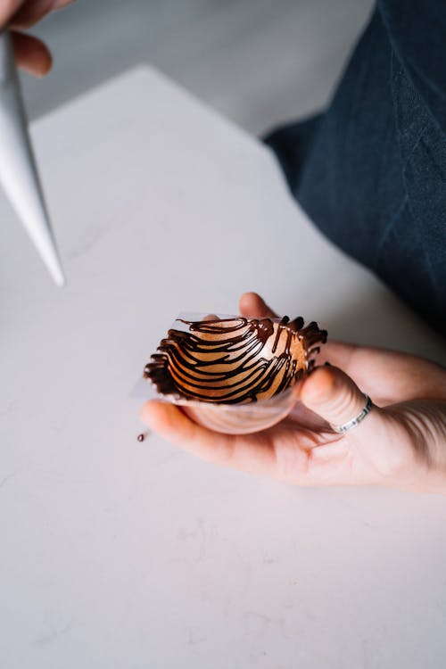 Woman Making a Chocolate Decoration from Melted Chocolate 