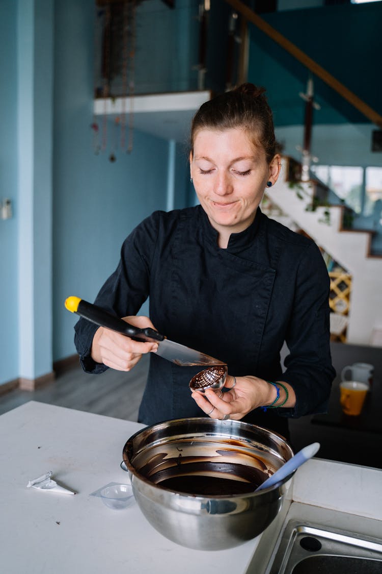 A Woman In Black Chef Jacket